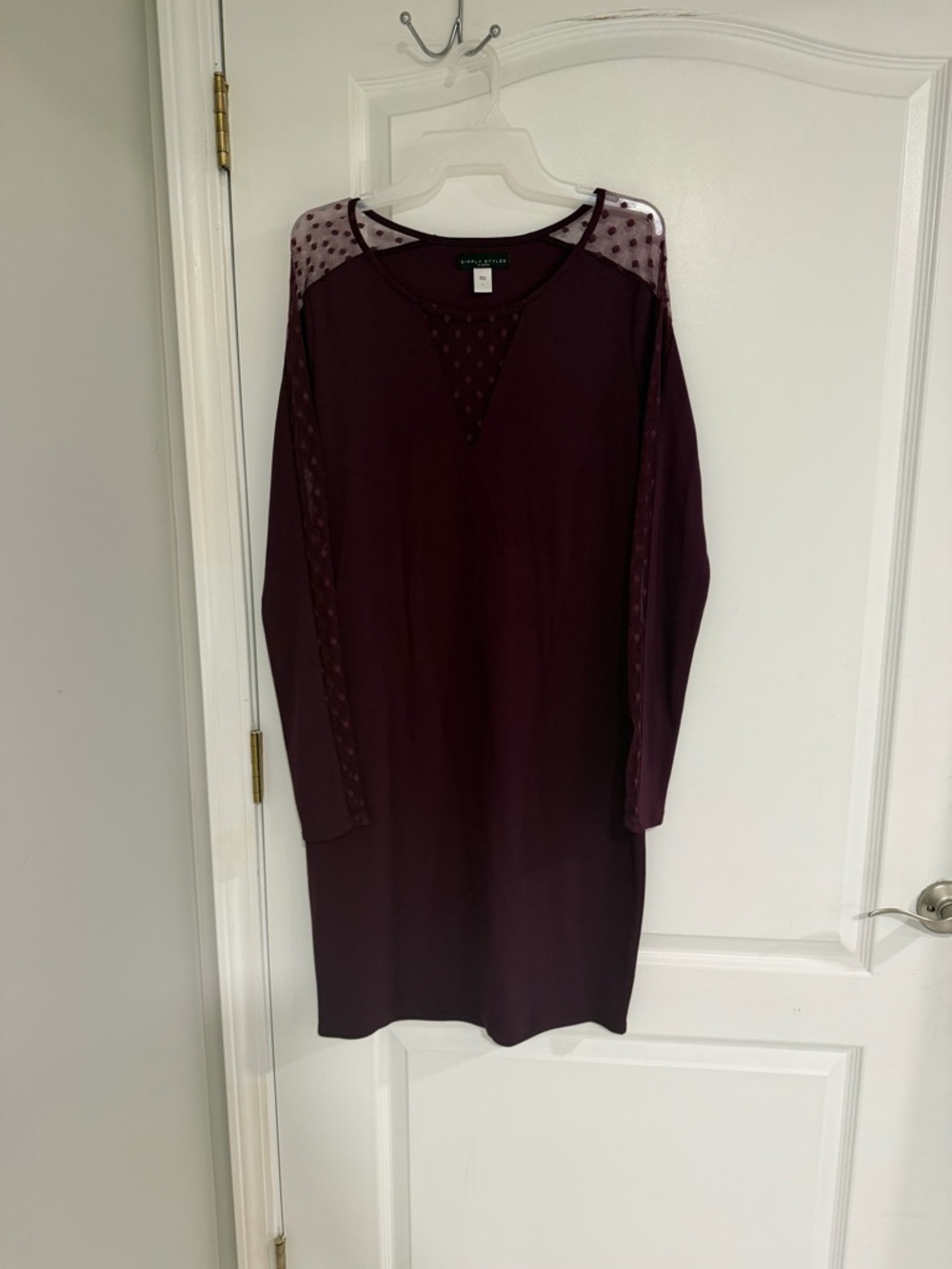 Knee length burgundy dress with sheer, polka dot sleeves